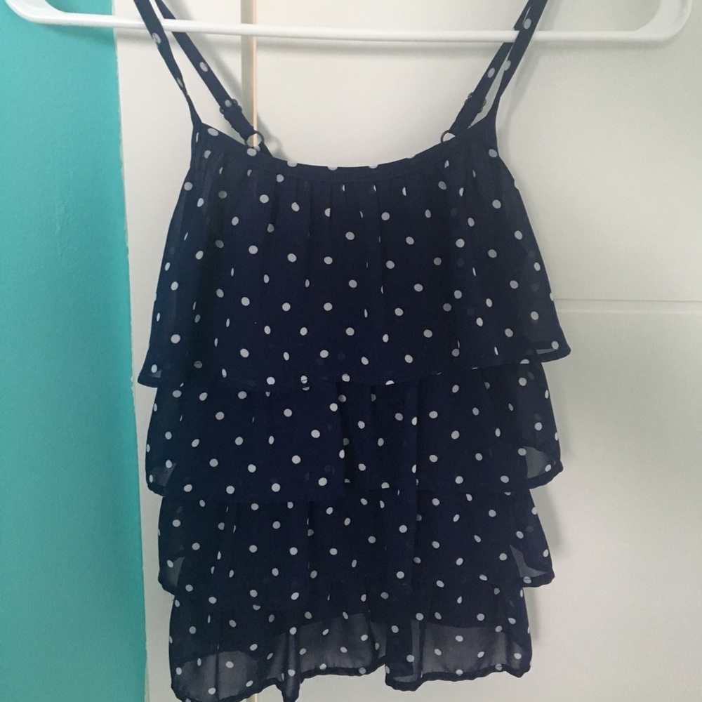 Cute purple, flowy tank with adjustable straps.
